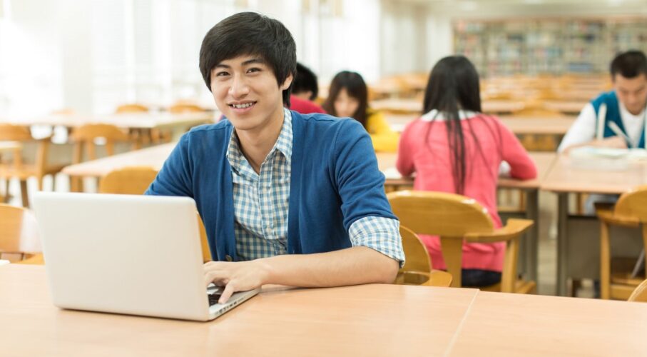 students looking at laptop